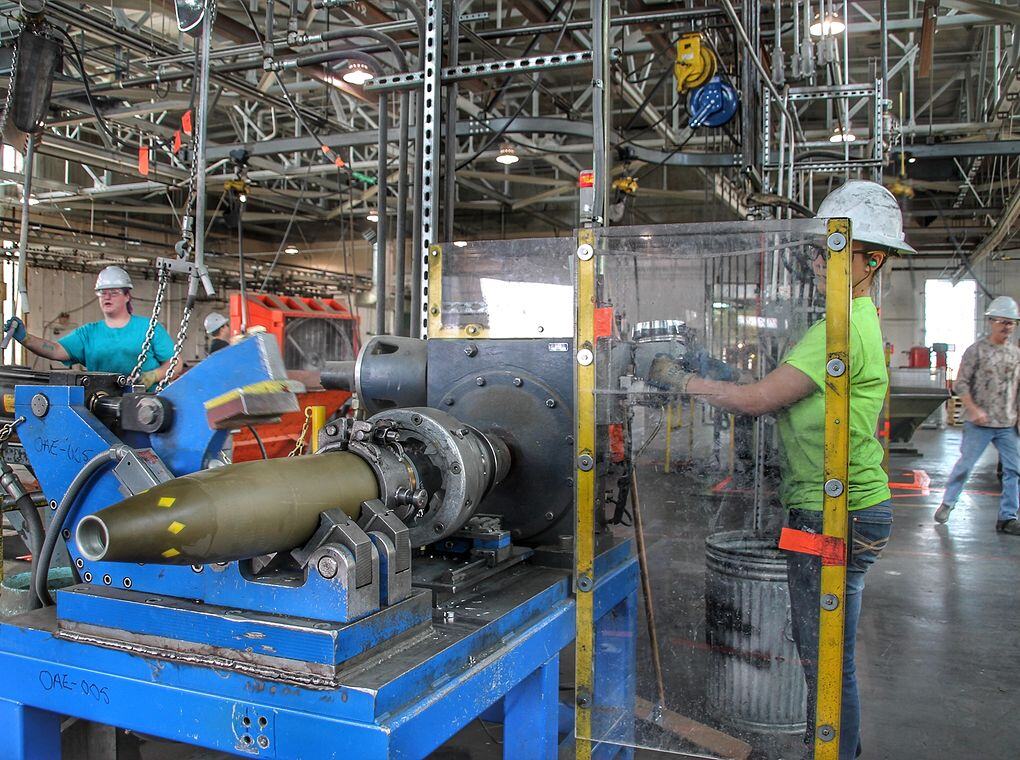 munitions factory worker operating machine