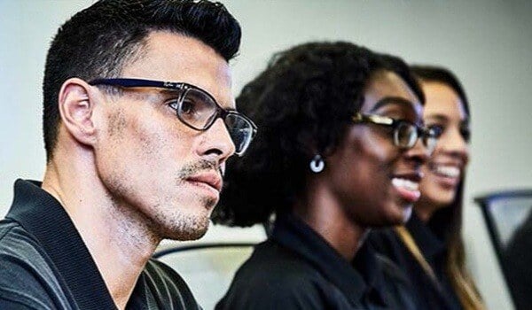 diverse SOC employees listening in meeting