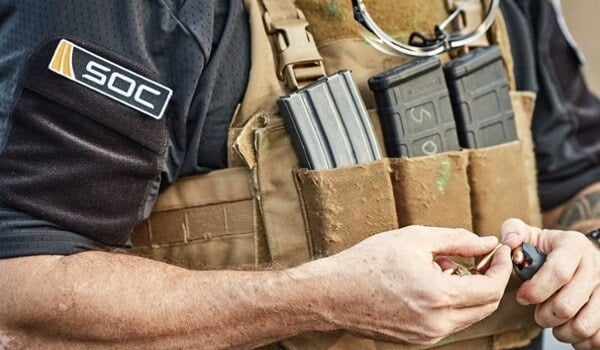SOC soldier loading ammo magazine